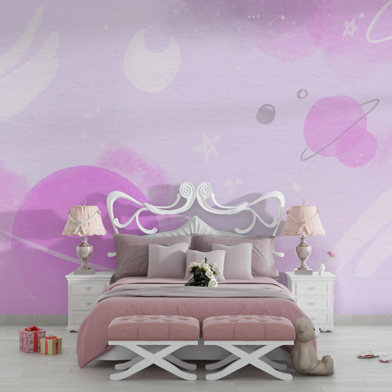 Pink space wallpaper transforming a playroom with gentle galaxy patterns