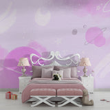 Pink space wallpaper transforming a playroom with gentle galaxy patterns