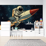 Space adventure wallpaper displayed in a modern kids bedroom, showing retro astronaut and rocket design against dark blue walls