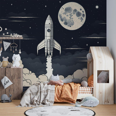 Space rocket wallpaper mural shown in modern kids bedroom with blue accents and star-themed decor