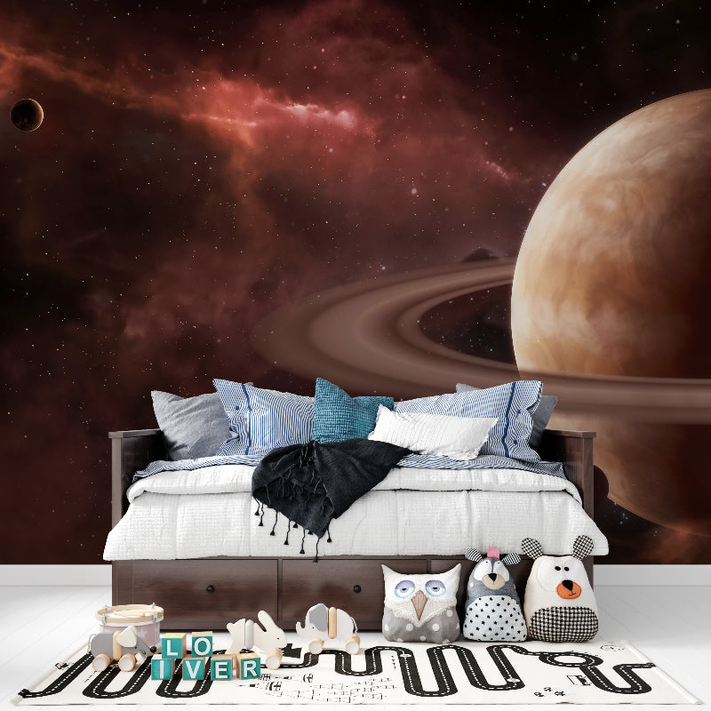 Saturn wall mural bringing cosmic vibes to kids bedroom with starry details