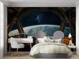 Space themed study with spacecraft window Earth view wallpaper