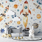 Space theme wallpaper in modern nursery showing watercolor rockets and planets creating a dreamy atmosphere