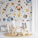 Reading nook with space theme wall mural featuring soft colored rockets and planets