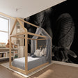 Black Spiderman wallpaper creating dramatic atmosphere in modern living room with leather furniture