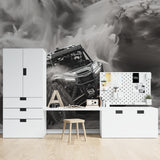 Racing car wallpaper installation in a teen bedroom showing the dramatic black and white contrast