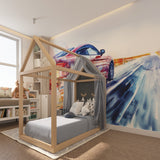 Sports car mural energizing a teen bedroom with gaming setup