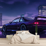 Office space with car enthusiast wallpaper showing purple city skyline