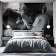 Black and white boxing wallpaper creating dramatic impact in modern home gym with training equipment