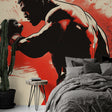 Boxing wallpaper mural displayed in modern home gym, showing dramatic silhouettes against red backdrop