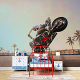 Sports mural displayed in a gaming room showing freestyle motocross action