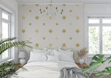Star mural wallpaper adding sparkle to a cozy nursery with soft lighting