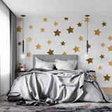 Golden star wallpaper bringing warmth to a modern living room with natural light