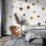 Metallic gold star wallpaper adorning a home office wall