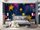 Galaxy stars mural in modern playroom with reading nook creating dreamy atmosphere