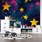 Stars and nebula mural in nursery showing soft golden and blue tones