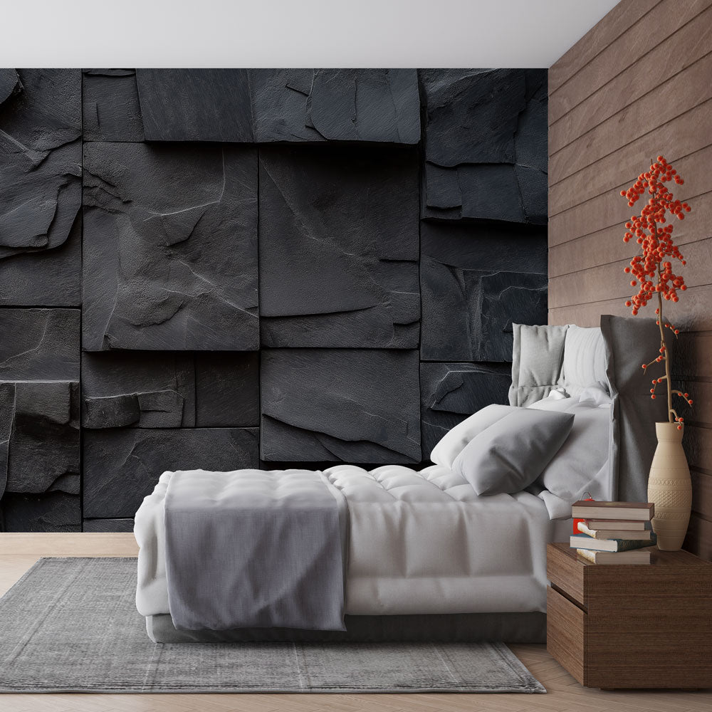Modern living room with black slate stone effect wallpaper creating dramatic accent wall