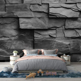 Modern living room featuring dramatic Black Slate Stone Wallpaper creating depth and texture on accent wall