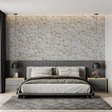 Stone effect wallpaper bringing natural texture to a minimal bedroom wall