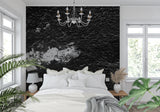 Black stone textured wallpaper in modern living room creating dramatic industrial backdrop