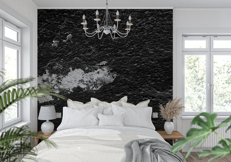 Black stone textured wallpaper in modern living room creating dramatic industrial backdrop