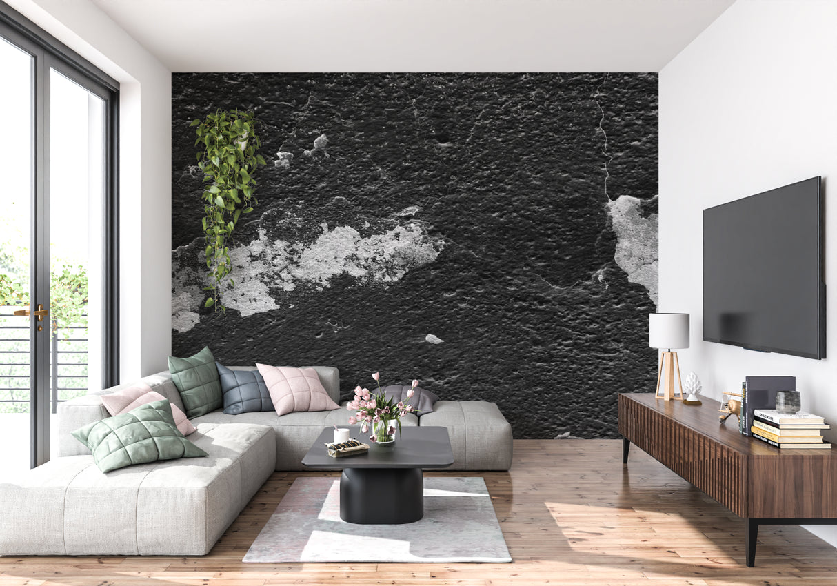 Industrial black stone wallpaper creating statement wall in loft apartment