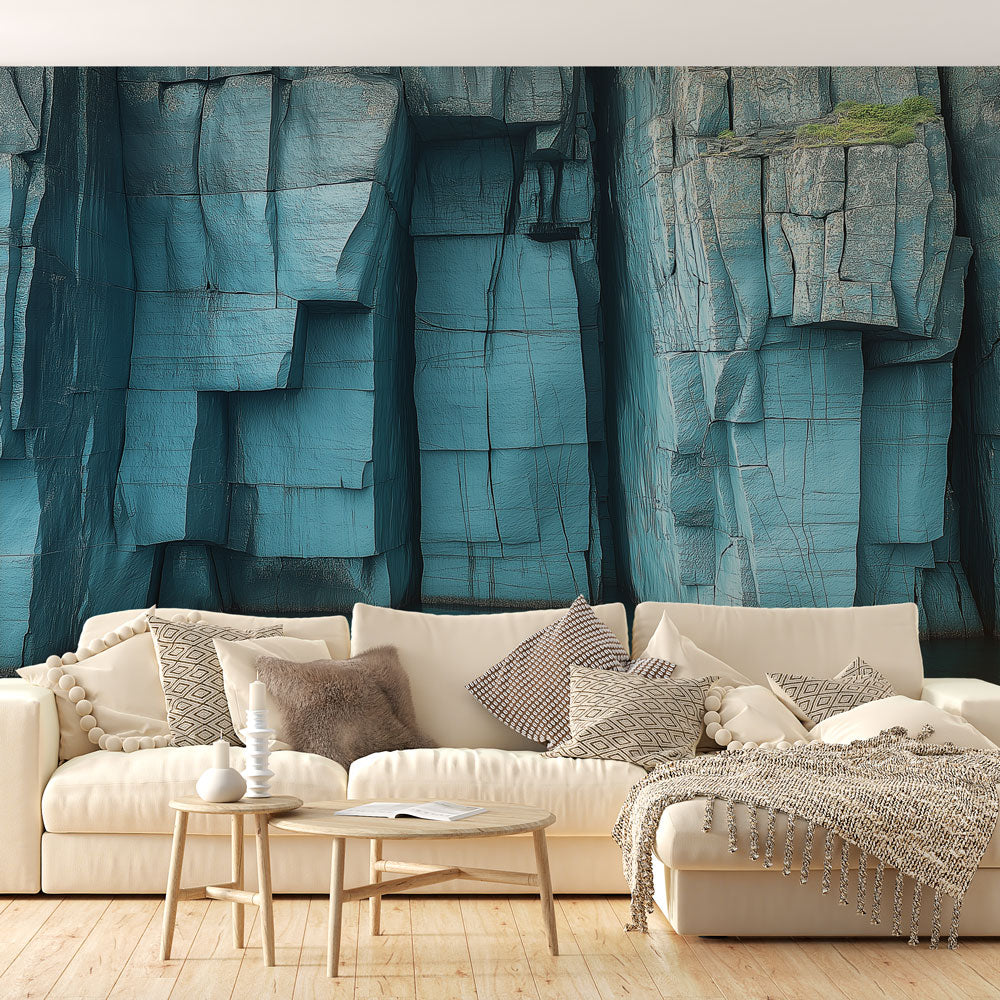 Blue stone wall mural in modern minimalist living room, creating dramatic architectural impact with geometric rock patterns