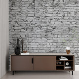 Grey stone wallpaper in modern living room creating industrial charm with natural light