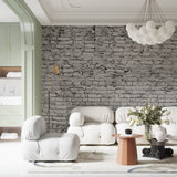 Industrial brick mural in home office with minimalist desk setup