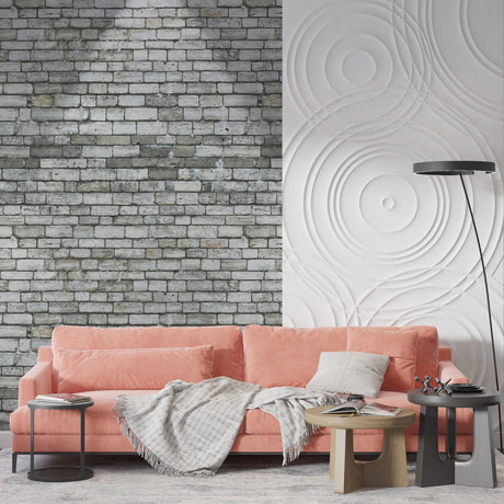 Grey stone brick wallpaper in modern living room creating industrial atmosphere