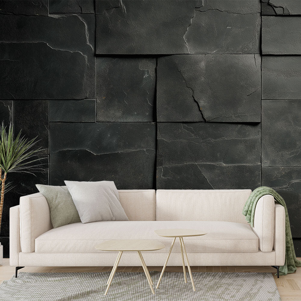 Modern black stone block wallpaper creating depth in a minimalist living room with ambient lighting