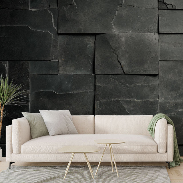 Modern black stone block wallpaper creating depth in a minimalist living room with ambient lighting