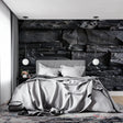 Black stone wallpaper in modern living room with gray sofa and minimalist decor