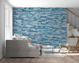 Modern blue stone wallpaper in bright contemporary living room with minimal furniture