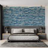 Blue stone wall mural adding texture to minimal dining room