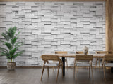 Grey block pattern mural wallpaper in an industrial-style dining room