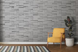 Stone block wallpaper adding texture to a modern bedroom wall