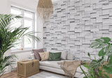 3D grey stone wallpaper creating depth in an entrance hallway