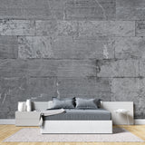 Grey stone block wall mural creating depth in modern bedroom setting