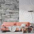 Modern grey stone wallpaper creating depth in a minimalist living room