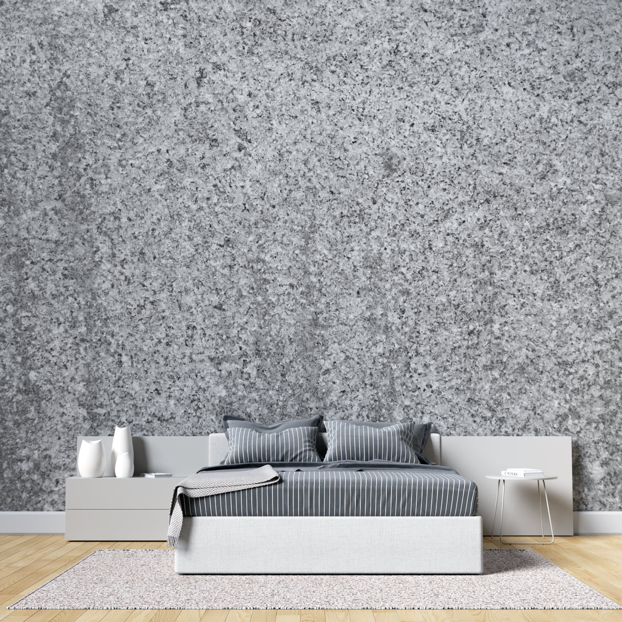 Modern grey stone wallpaper creating depth in a minimalist living room with natural light