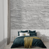 Stone effect wall mural featuring grey lines in minimal dining space