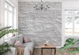 Linear stone wallpaper creating depth in hallway setting