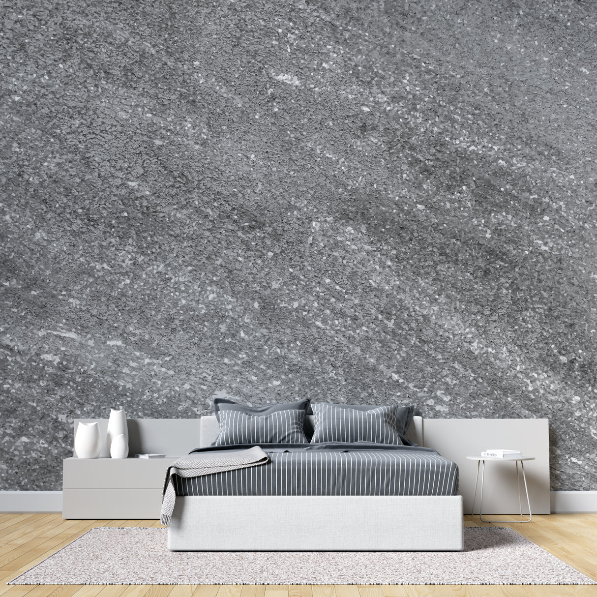 Modern grey stone effect wallpaper in contemporary living room with natural light highlighting metallic details