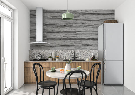 Grey stone effect wallpaper in modern living room setting showing textured slate design