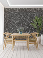Modern grey stone wallpaper with sparkle effect in a minimalist living room setting