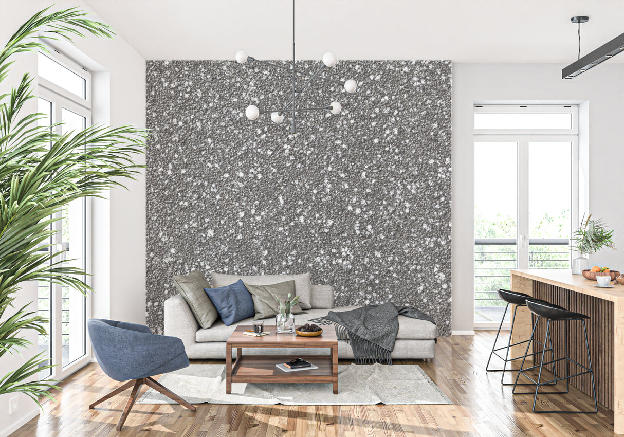 Speckled grey stone mural creating depth in a contemporary dining room