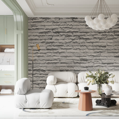 Modern grey stone wallpaper creating depth in a minimal living room setting