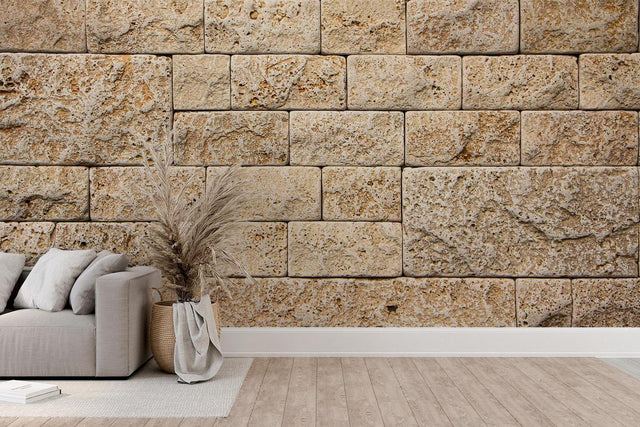Stone block wallpaper creating a stunning accent wall in a modern living room with beige and natural tones