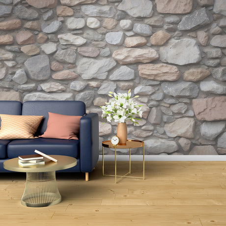 Stone wall mural in modern living room showing natural gray and beige tones creating depth and texture